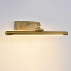 Gold picture light mounted above a framed artwork casting warm even light