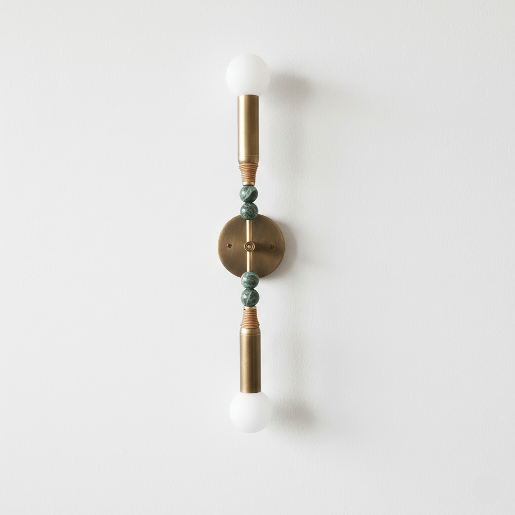 Antique brass wall lamp with marble accent on a neutral wall