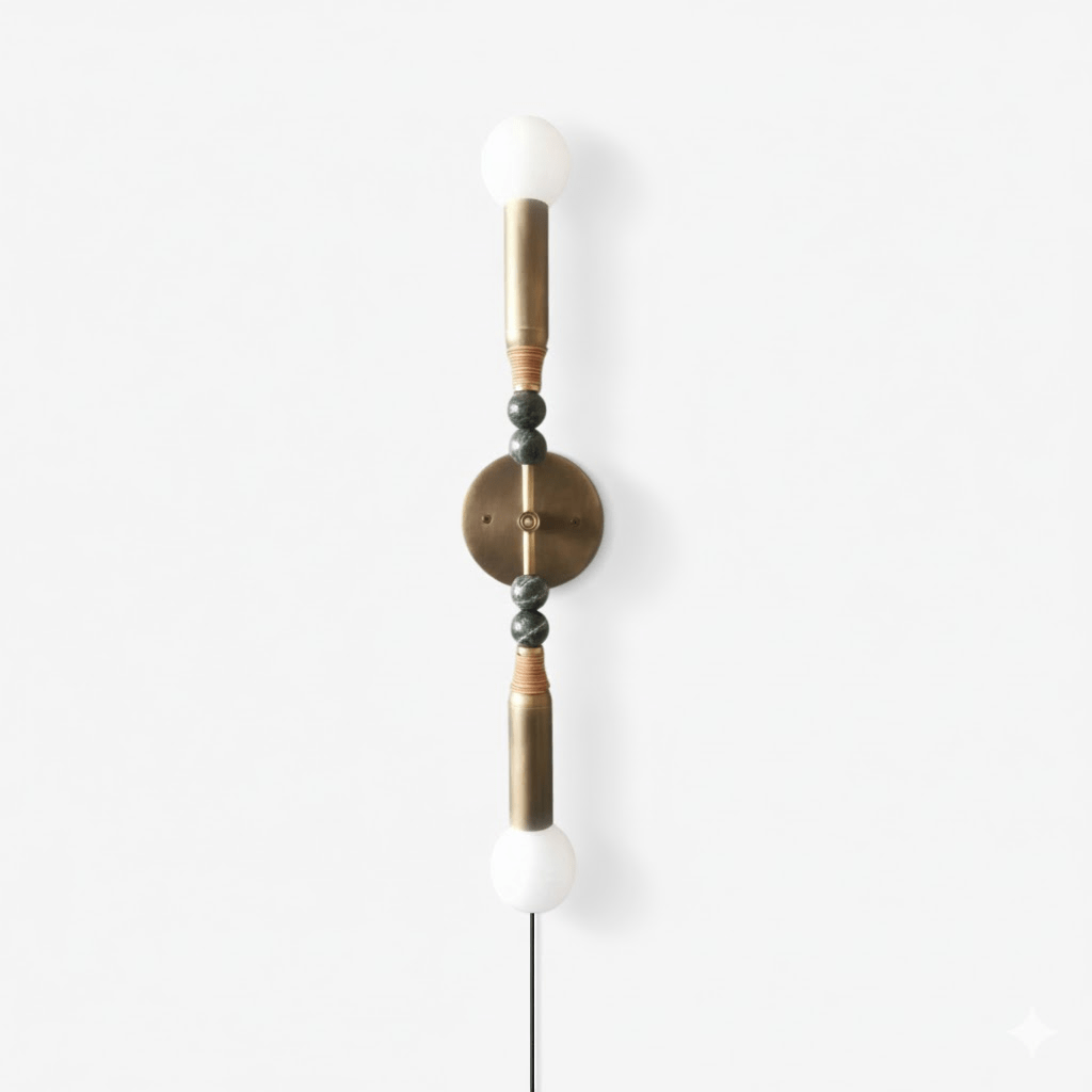 Clérachic wall light on white, white stone spheres capping the top and bottom of a bead-strung brass rod.