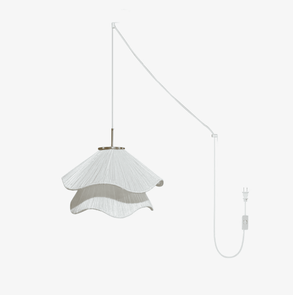 Ethereal Bloom plug-in pendant light glowing with layered white pleated shade and gold hardware