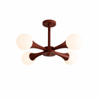 Unlit at an angle on a plain white background, this Clérachic chandelier's walnut-stained arms hold five opal glass globes.