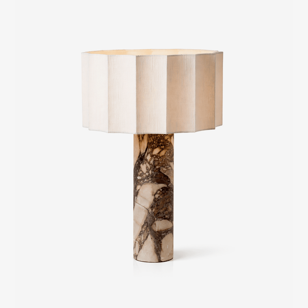 A fluted cream shade tops the veined marble column of this Clérachic table lamp, shown against a plain pale background.