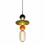 Tinted glass jar pendant light shown against a plain backdrop
