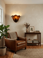 Petalia wall sconce green glass shade glowing against a pale wall