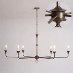 Brass candle chandelier hung above a styled living space
