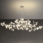 Porcelain ginkgo leaves fanned along glowing brass branches