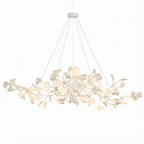 Detail of white porcelain ginkgo leaves on a brass bough
