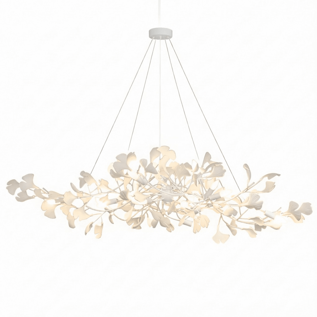 Detail of white porcelain ginkgo leaves on a brass bough