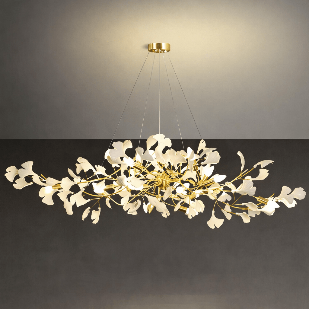 Linear brass branch chandelier with white porcelain ginkgo leaves