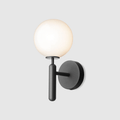This black Clérachic wall light stands unlit against a plain light grey background, its round white glass globe clearly shown.