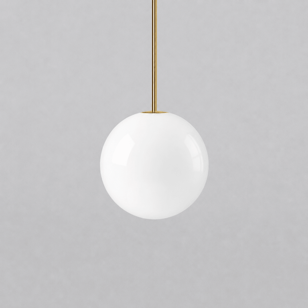 Opal glass globe pendant lights shown in a range of sizes