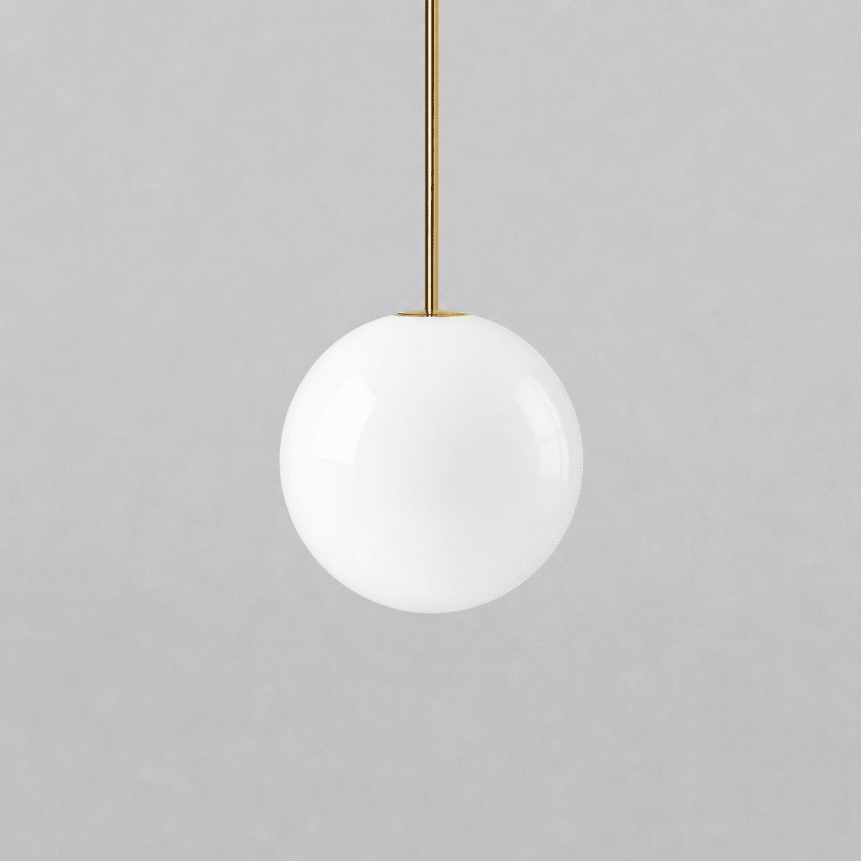 Opal glass globe pendant lights shown in a range of sizes
