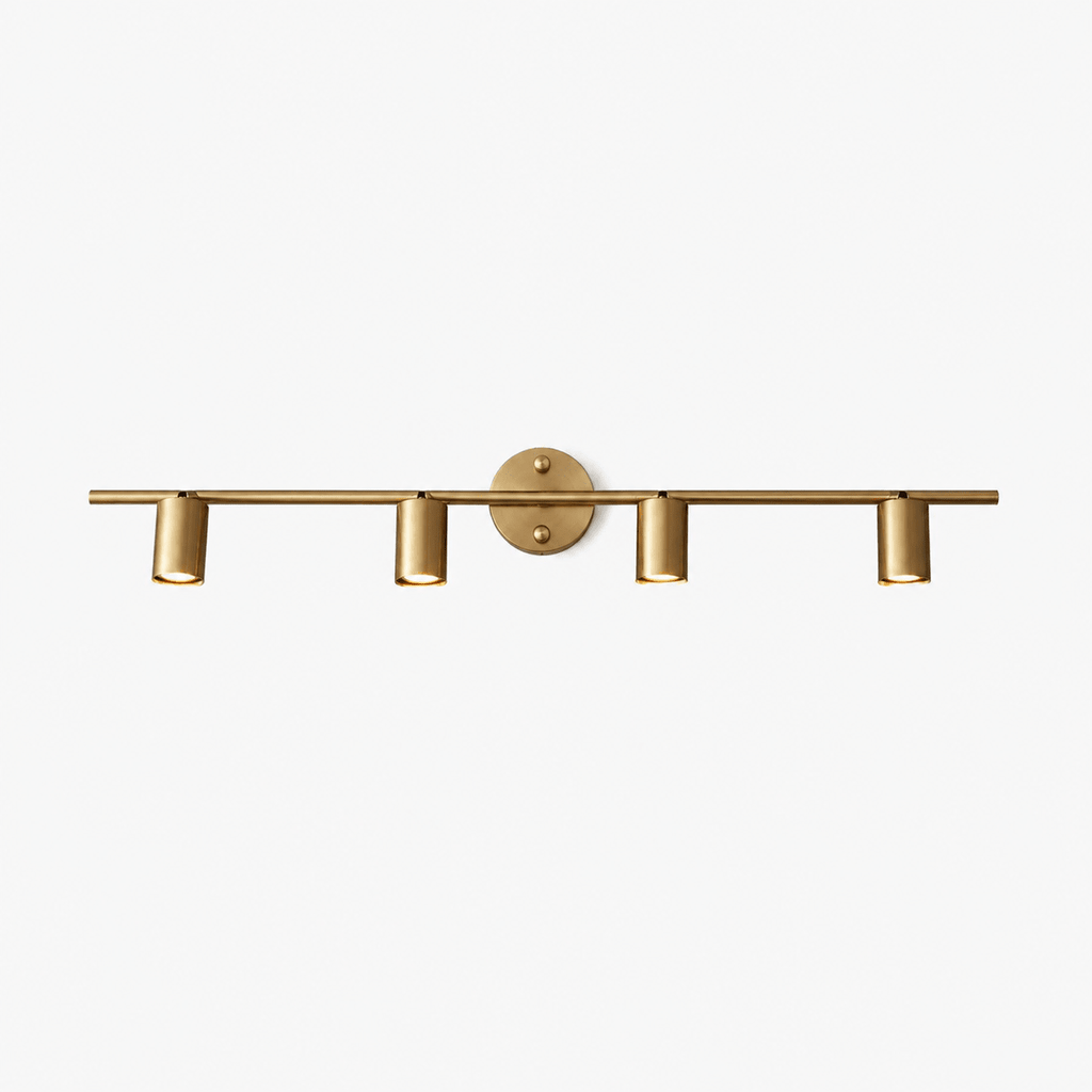 Brass spotlight wall light shown in a styled interior setting
