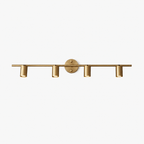 Brass spotlight wall light shown in a styled interior setting