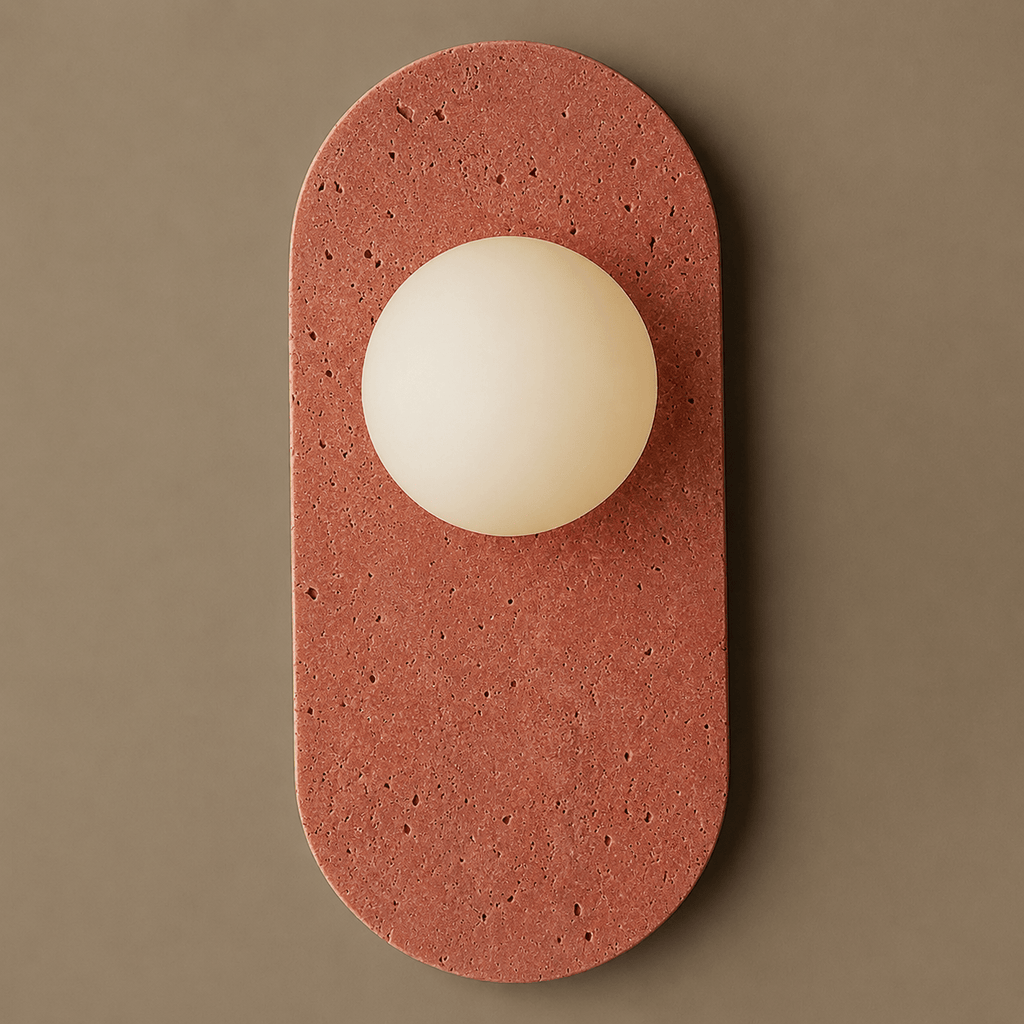 Rust-red travertine with visible natural pitting gives this Clérachic wall sconce a warmer, more textured stone finish.