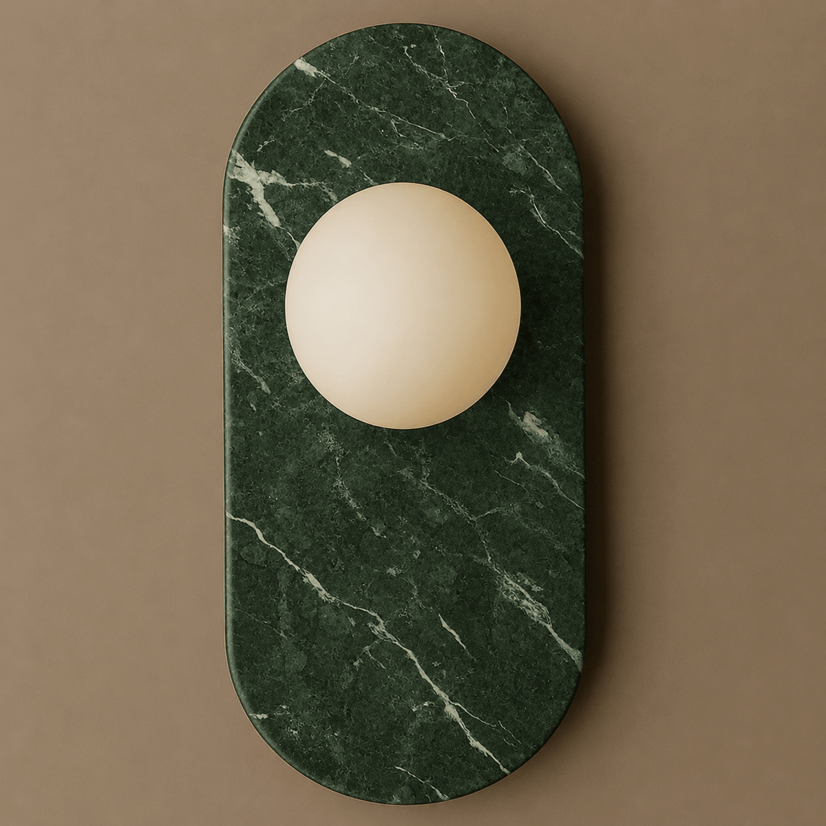 Deep green marble with fine white veining defines this Clérachic wall sconce, photographed close against a taupe backdrop.