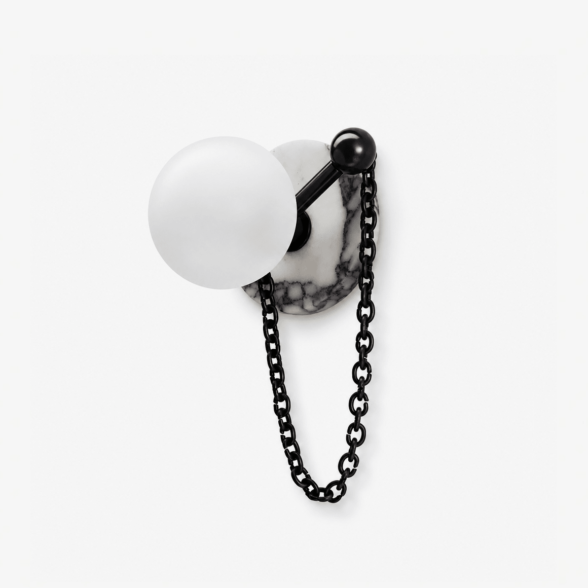 Clérachic wall sconce with a frosted white glass globe on a black arm, fixed to a pale marble backplate with a black chain drop, shown on white.
