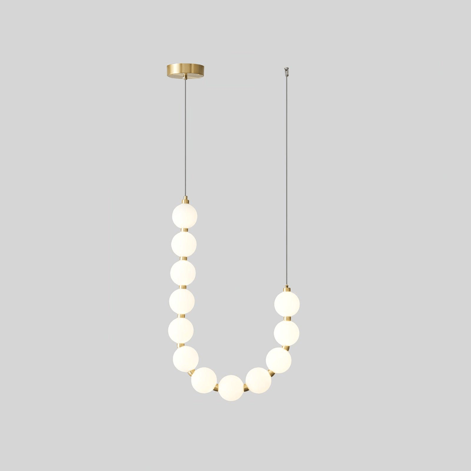 Acrylic pearl chandelier with white orbs on a brass ring frame