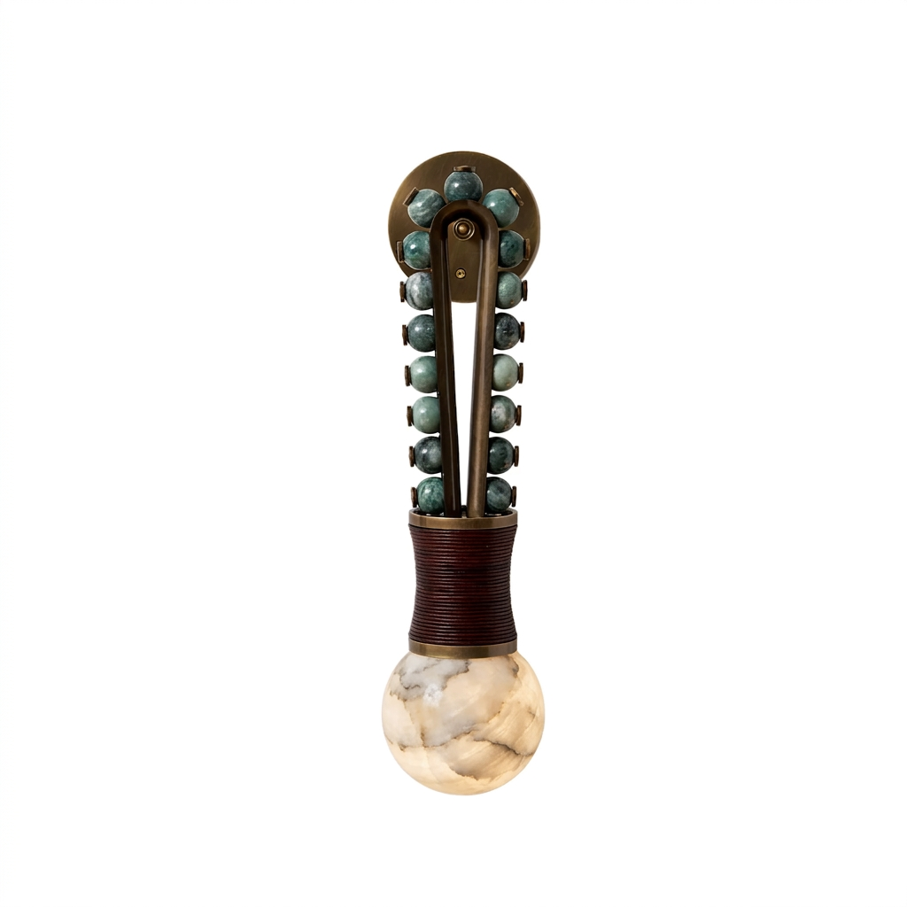 Against a plain backdrop, this Clérachic wall light shows a darker frame strung with teal-green beads above the globe.