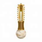 In an isolated view, this Clérachic wall light shows a brass frame with golden-toned beads leading down to the alabaster globe.