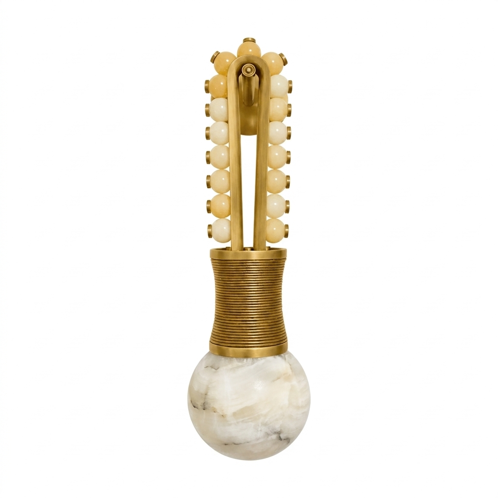 Alone against white, this Clérachic wall light displays pale cream beads climbing a brass frame to the alabaster globe below.