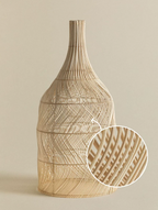A close-up inset shows the crosshatched rattan weave on this Clérachic pendant's rounded body.