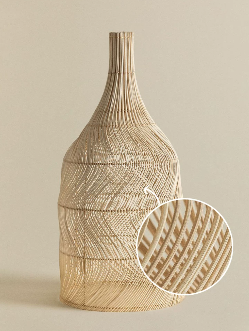 A close-up inset shows the crosshatched rattan weave on this Clérachic pendant's rounded body.