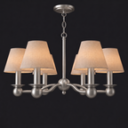 Unlit against a dark background, this brushed nickel Clérachic chandelier shows its six branching arms and drum shades.