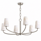 On a plain backdrop, the link chain of this Clérachic chandelier suspends its woven frame in brushed nickel.