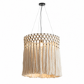 Seen straight-on against a plain backdrop, the tiered cotton fringe of this Clérachic pendant cascades in soft waves.