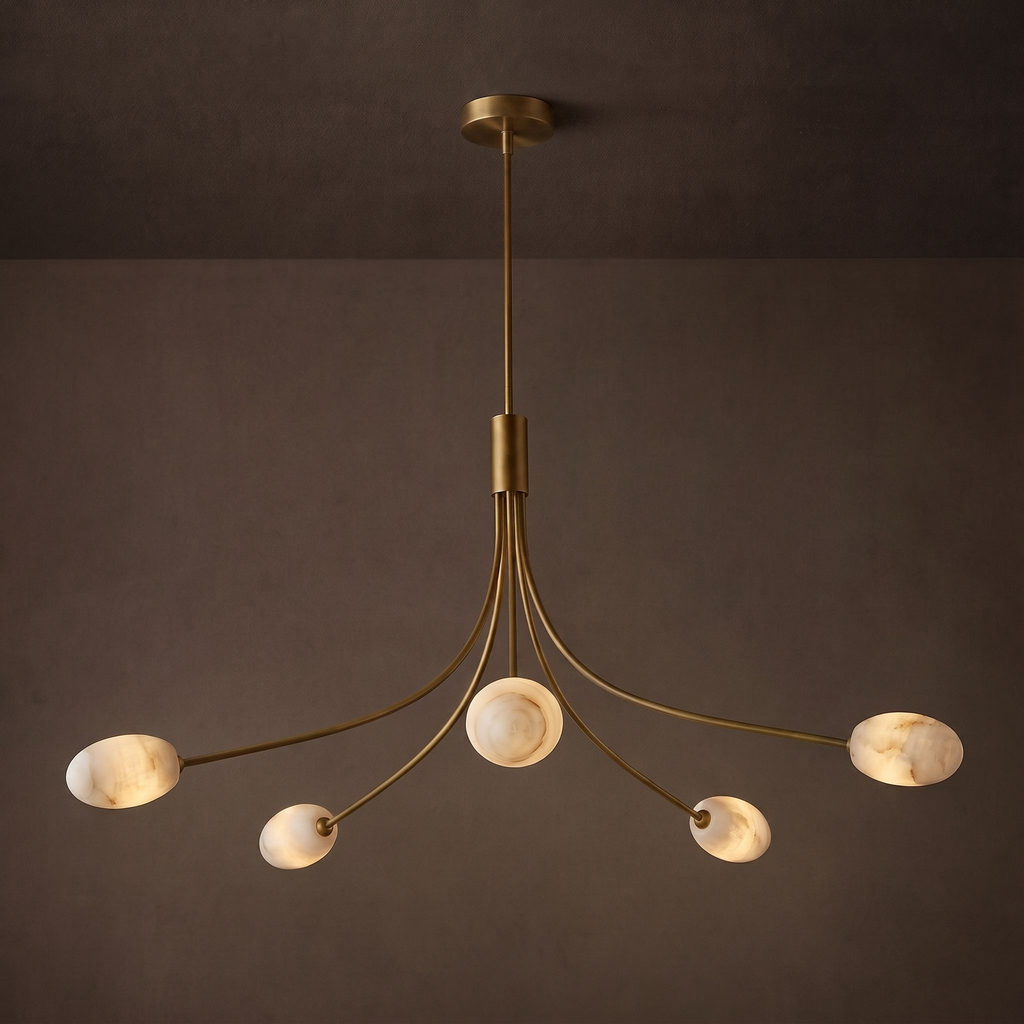 Studio shot of this Clérachic chandelier in brushed brass, seen face-on with its five alabaster discs glowing softly.