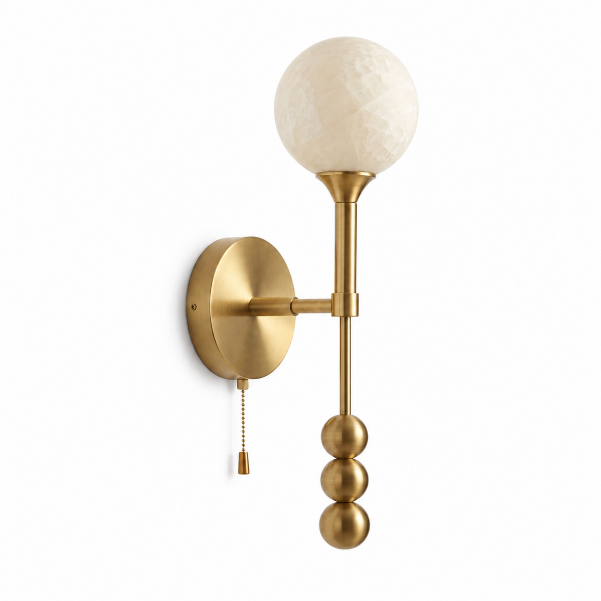 This Clérachic wall sconce in brushed brass shows its pull-chain switch hanging beside the stacked metal balls.