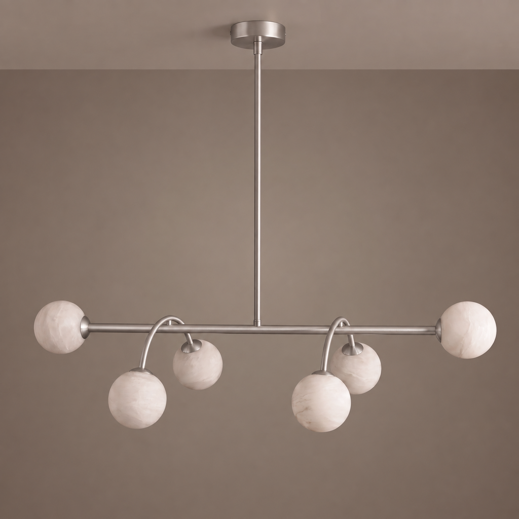 Front-facing studio shot of this Clérachic chandelier in brushed nickel against a plain taupe backdrop.