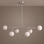 Front-facing studio shot of this Clérachic chandelier in brushed nickel against a plain taupe backdrop.
