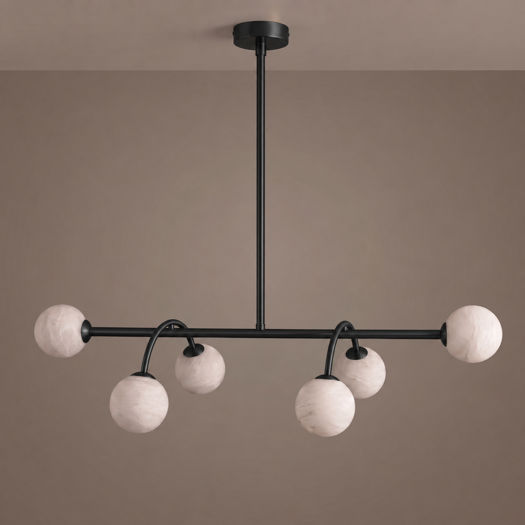 This Clérachic chandelier in matte black is shown face-on, its curved arms holding staggered alabaster balls.
