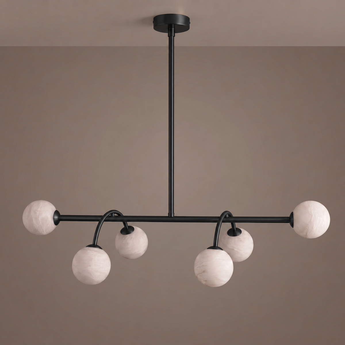 This Clérachic chandelier in matte black is shown face-on, its curved arms holding staggered alabaster balls.