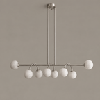Side view of this Clérachic chandelier in brushed nickel, showing the dual rods that suspend the bar.