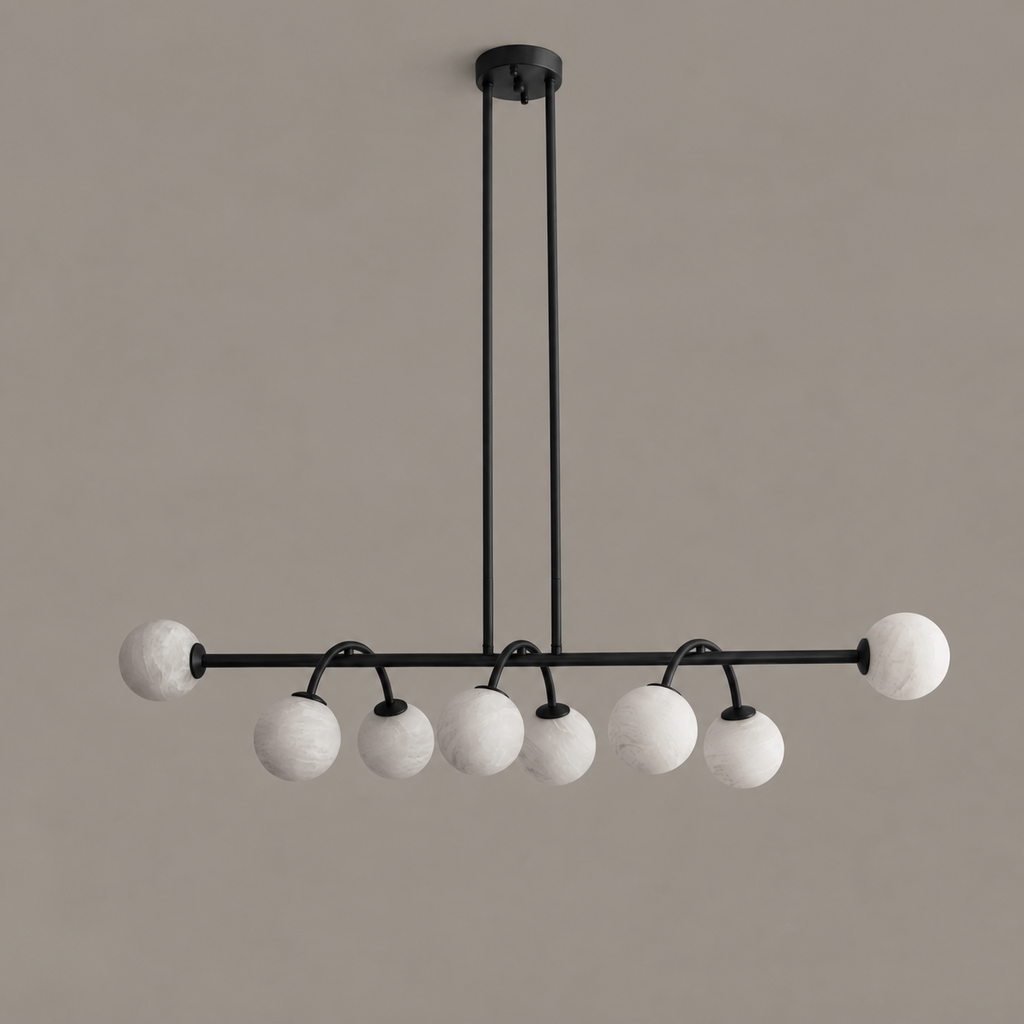 This Clérachic chandelier in matte black is shown from the side, its two rods mounted to a round canopy.