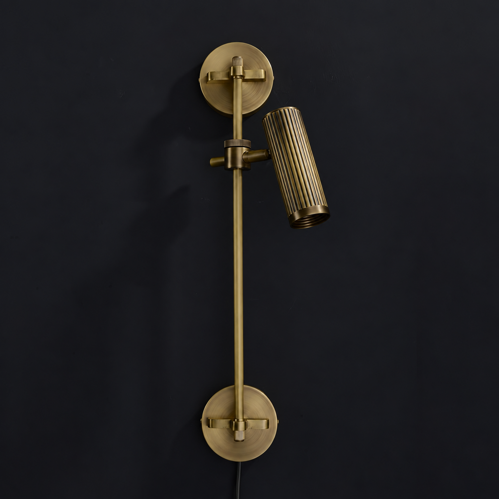 A close angle of this Clérachic plug-in spotlight in bronze finish, showing both ribbed heads on its rail.