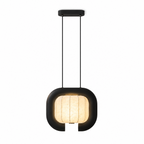 Studio shot of this black, closed-loop Clérachic pendant, its rounded shade glowing beneath a small ceiling plate.