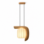 Studio image of this light wood, bent-style Clérachic pendant, its curved arm cradling a glowing shade.