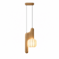 This light wood, vertical-style Clérachic pendant appears here in studio, its tall curved arm topped with a glowing shade.