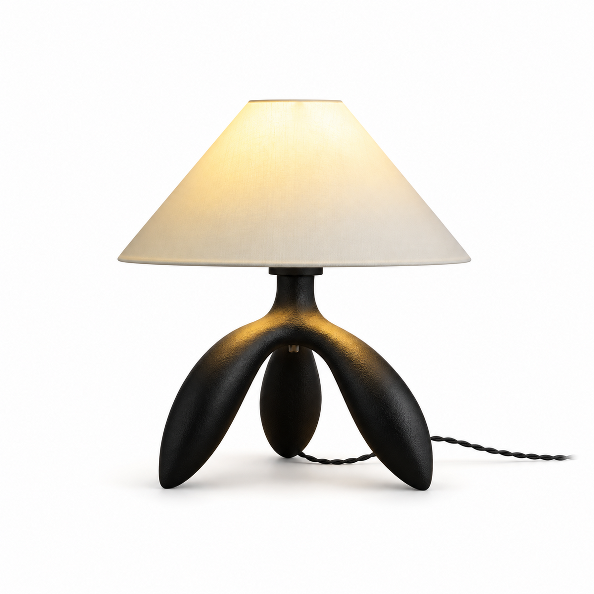 Studio image of this Clérachic lamp in elegant black, its glossy tripod base beneath a cream cone shade.