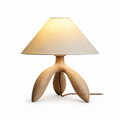 Studio image of this Clérachic lamp in light wood, its pale tripod base and matching cord shown plain.