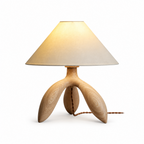 Studio image of this Clérachic lamp in light wood, its pale tripod base and matching cord shown plain.