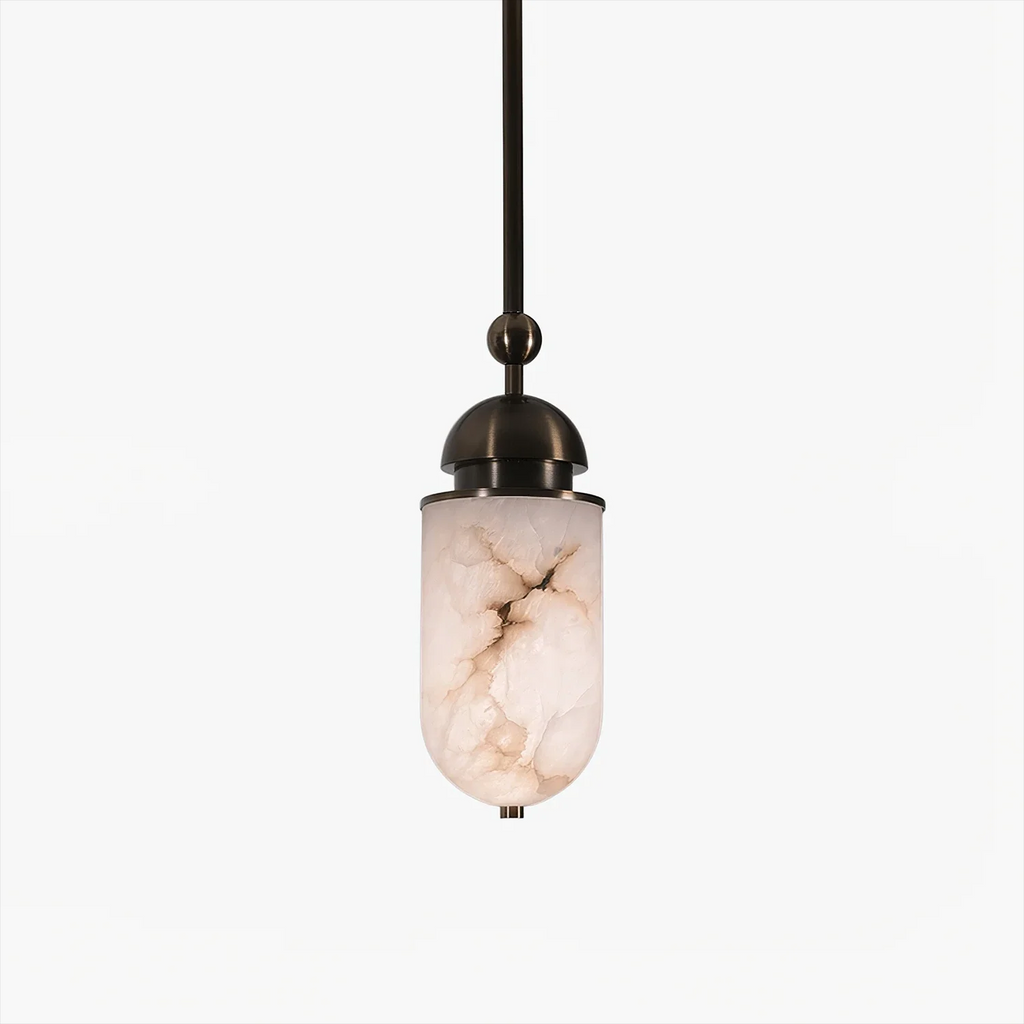 Close view of a single Clérachic pendant capsule, its marbled alabaster shade glowing warm beneath a sphere joint and finial.