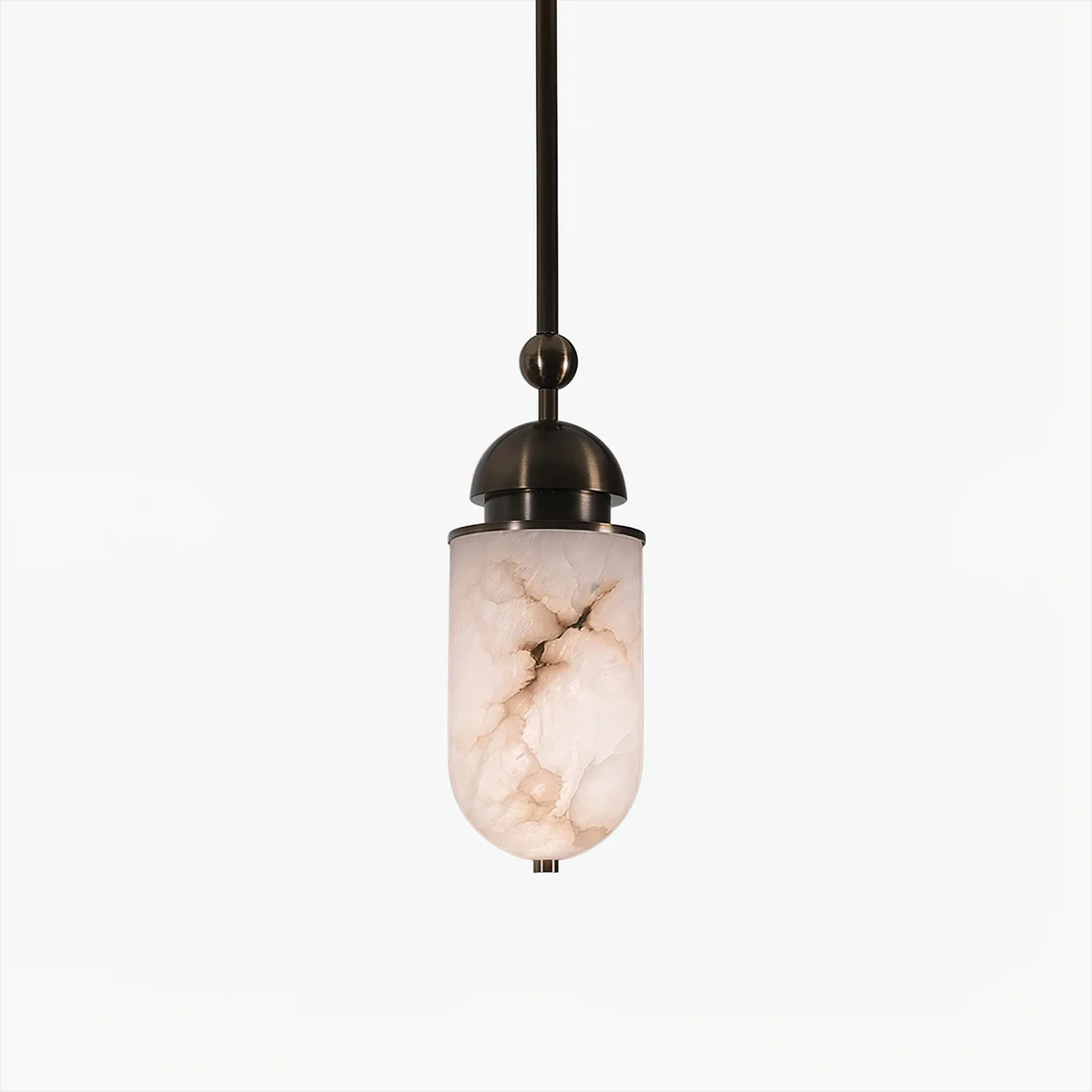 Close view of a single Clérachic pendant capsule, its marbled alabaster shade glowing warm beneath a sphere joint and finial.