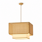 Product view of this Clérachic pendant on a twisted cord, its rattan lattice box shade glowing over a fabric panel.