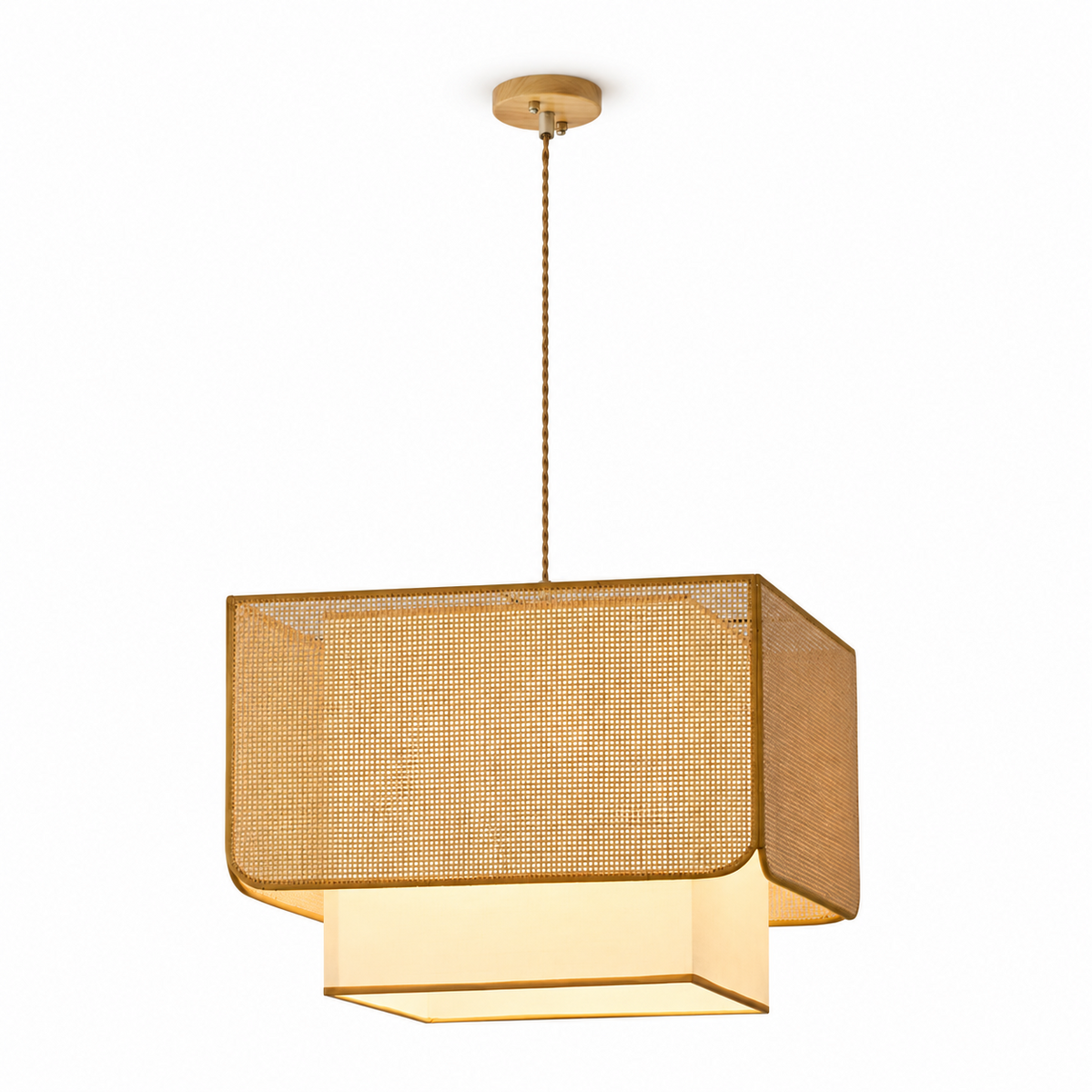 Product view of this Clérachic pendant on a twisted cord, its rattan lattice box shade glowing over a fabric panel.