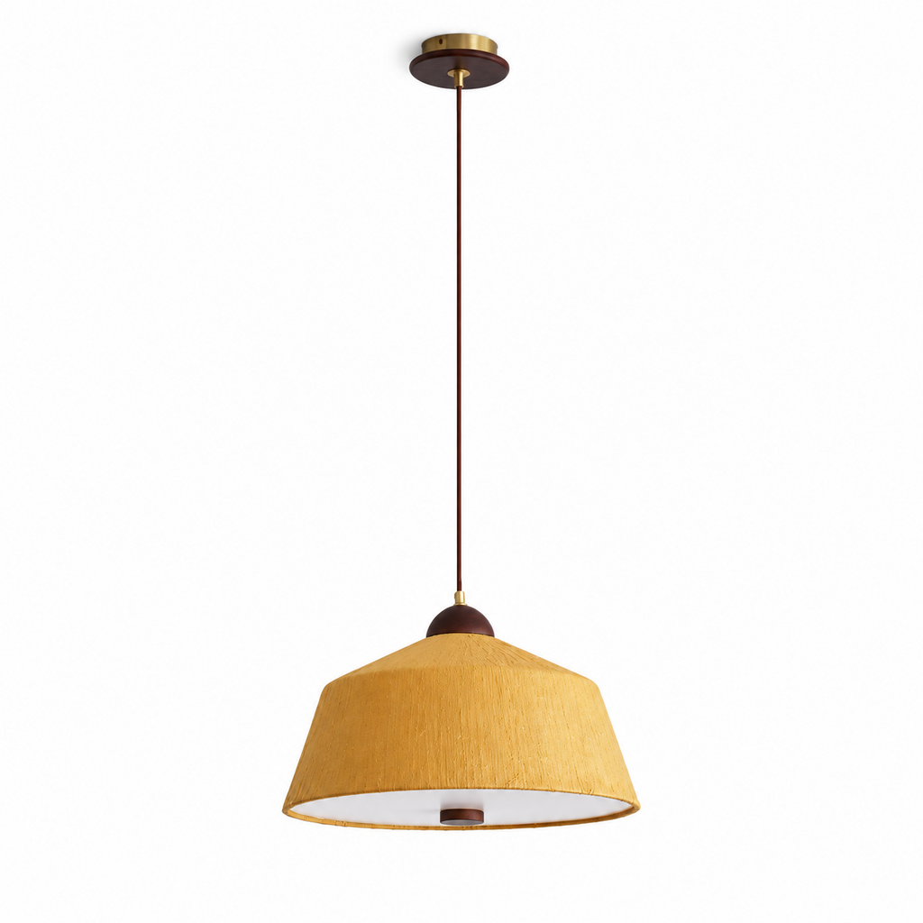 This Clérachic pendant shown in a deeper yellow rice paper shade, hung from its brass canopy against a plain backdrop.